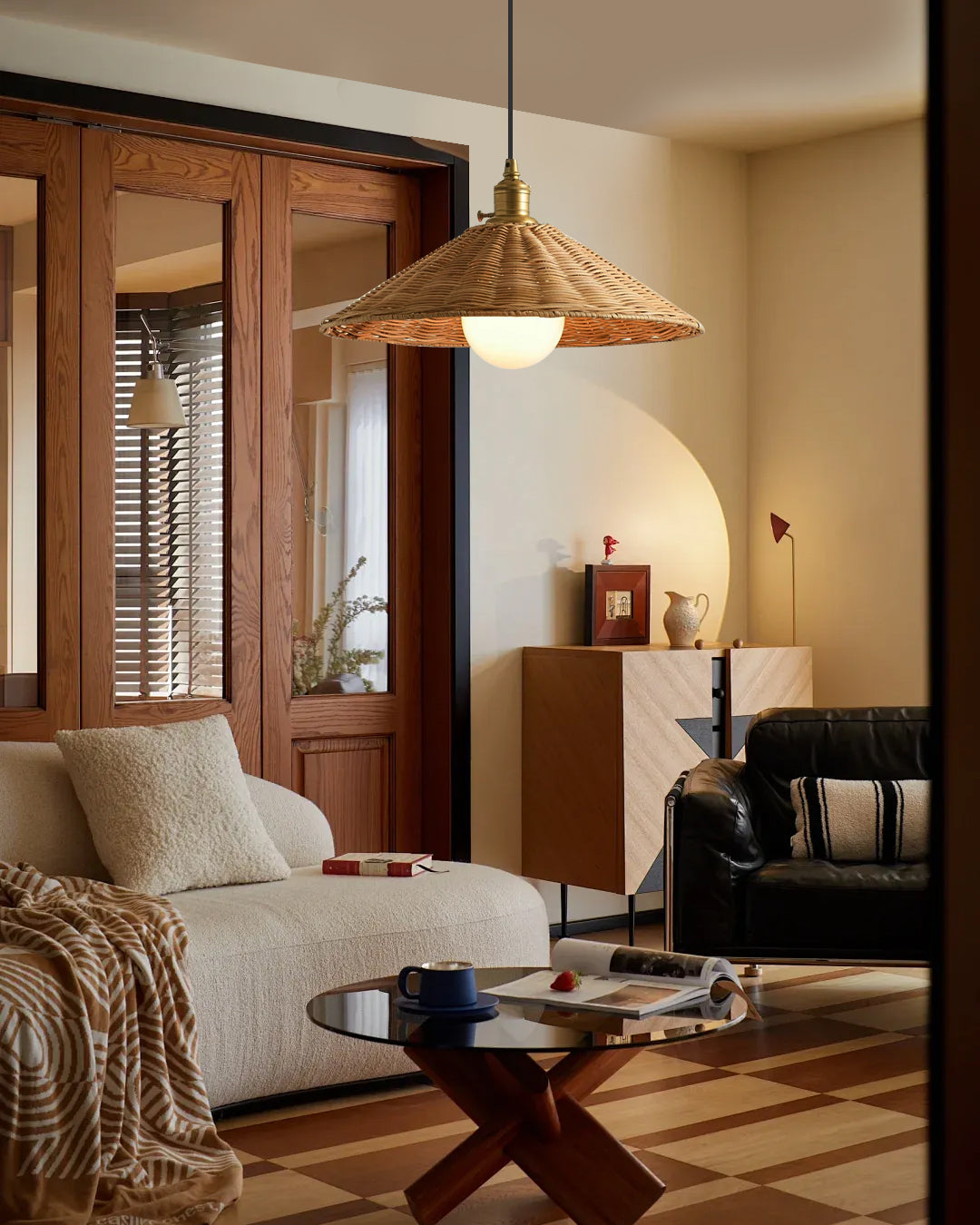 The Agoura Pendant Light hanging over a modern dining table.