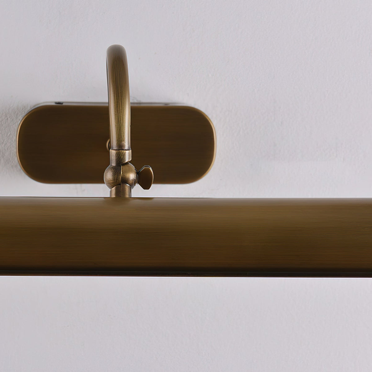 The Ainsworth Black Wall Sconce in a minimalist interior design.