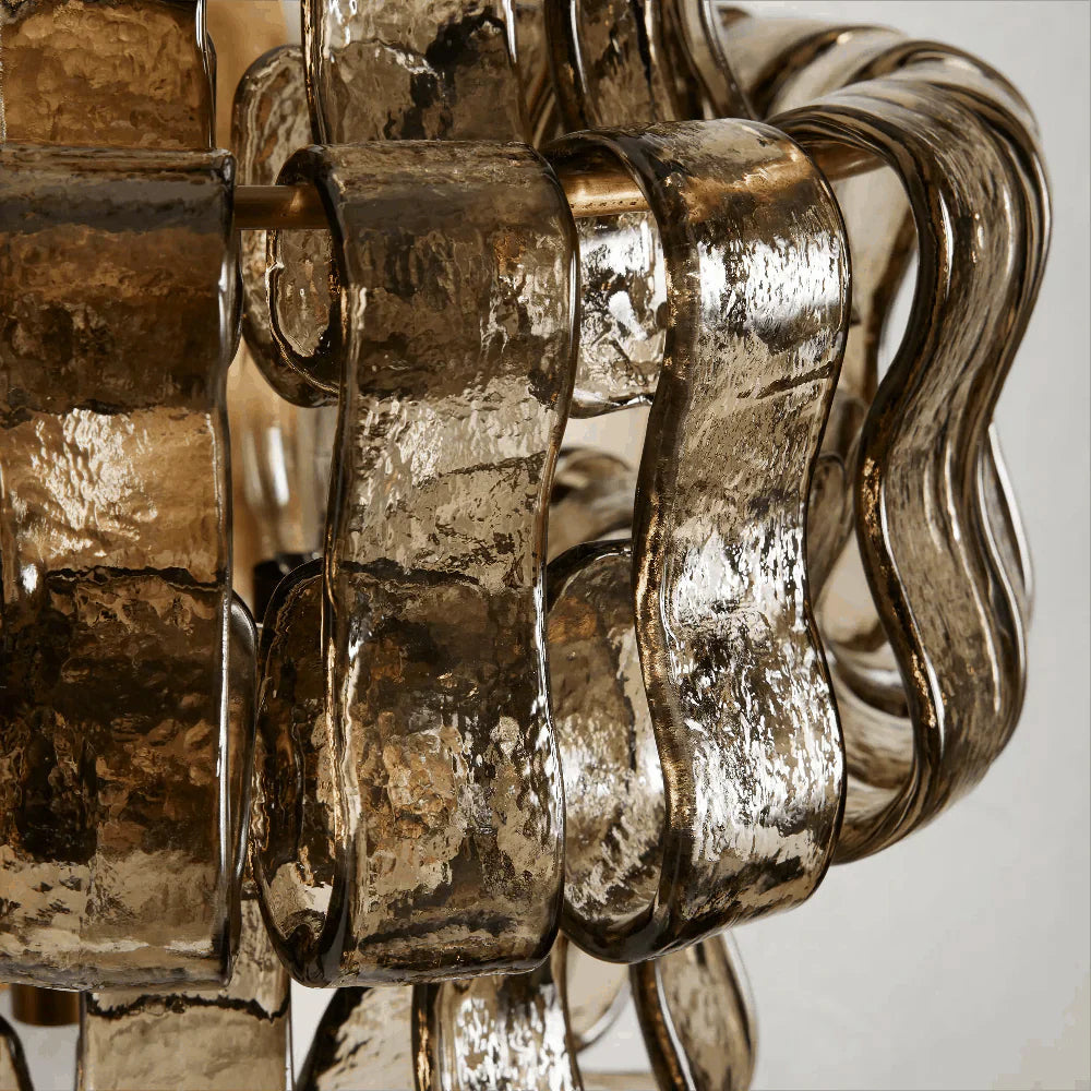 Albano Wall Lamp in clear glass, unlit, showing its form.