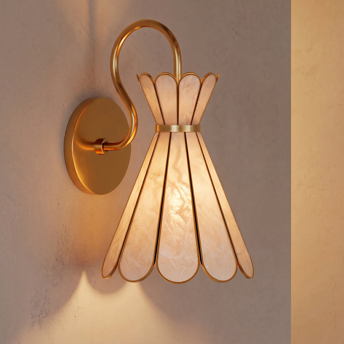 Angled view of the Alito wall light mounted on a wall, highlighting its sculptural form.
