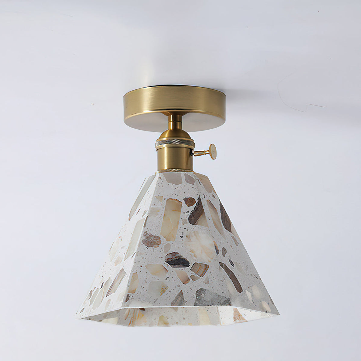 The gold mounting plate of the Alvaro Ceiling Lamp.