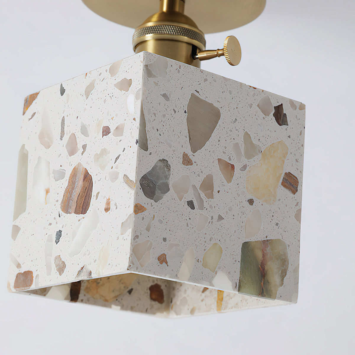 Detail of the seam where the metal and stone meet on the Alvaro lamp.