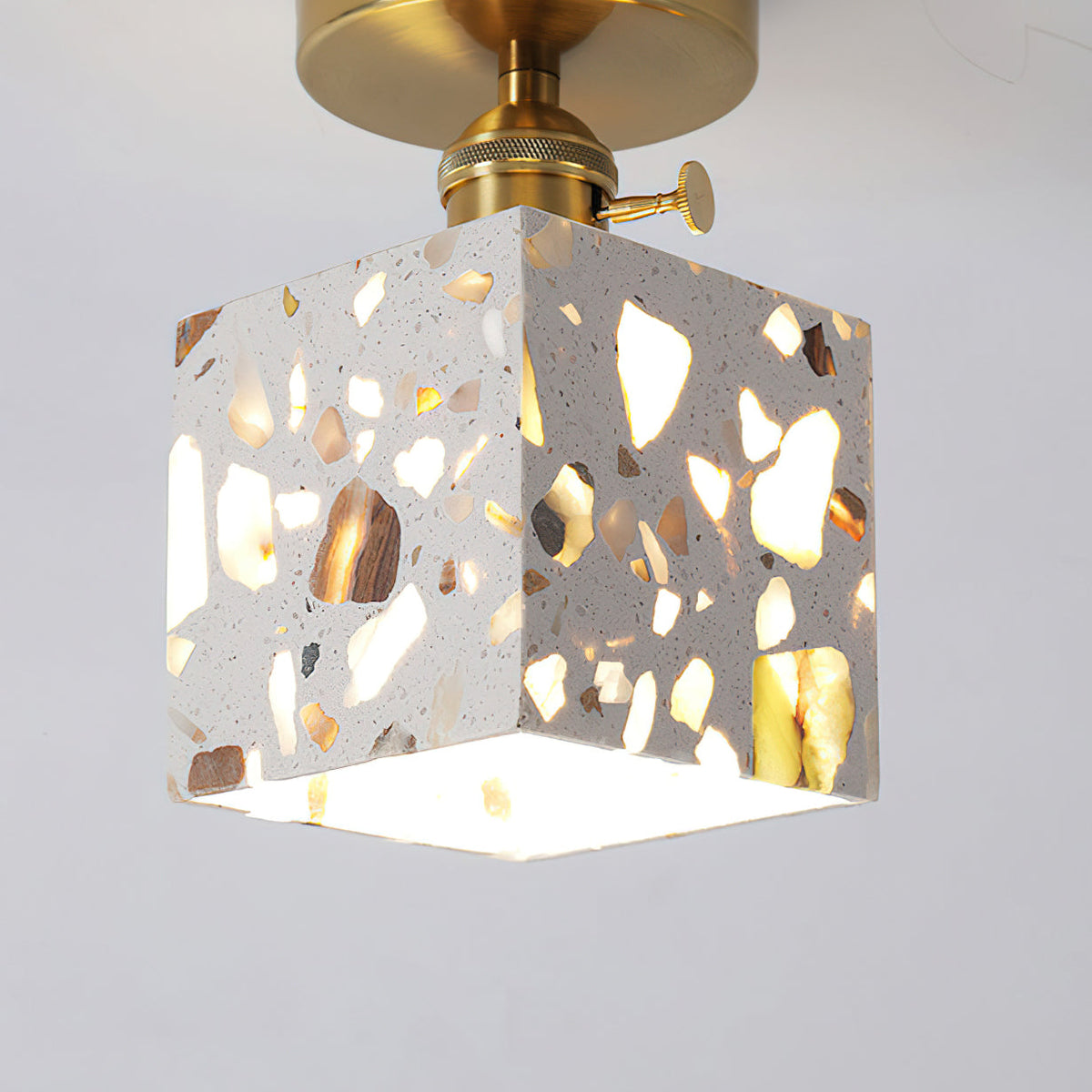 The texture of the translucent stone shade on the Alvaro Ceiling Lamp.