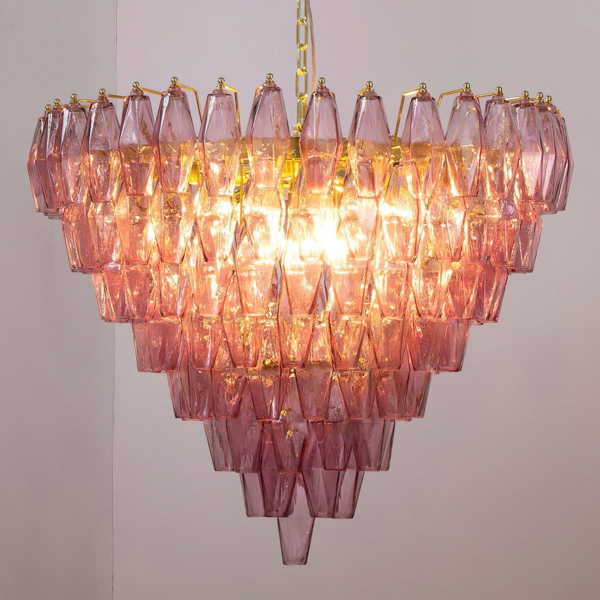 Close-up view of the interlocking polyhedral glass prisms of the Ametista Chandelier.