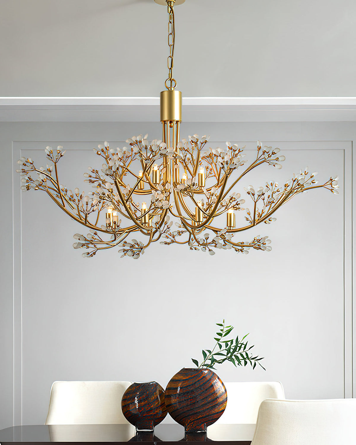 Detail shot of the hand-brushed brass branches and G9 bulb socket.