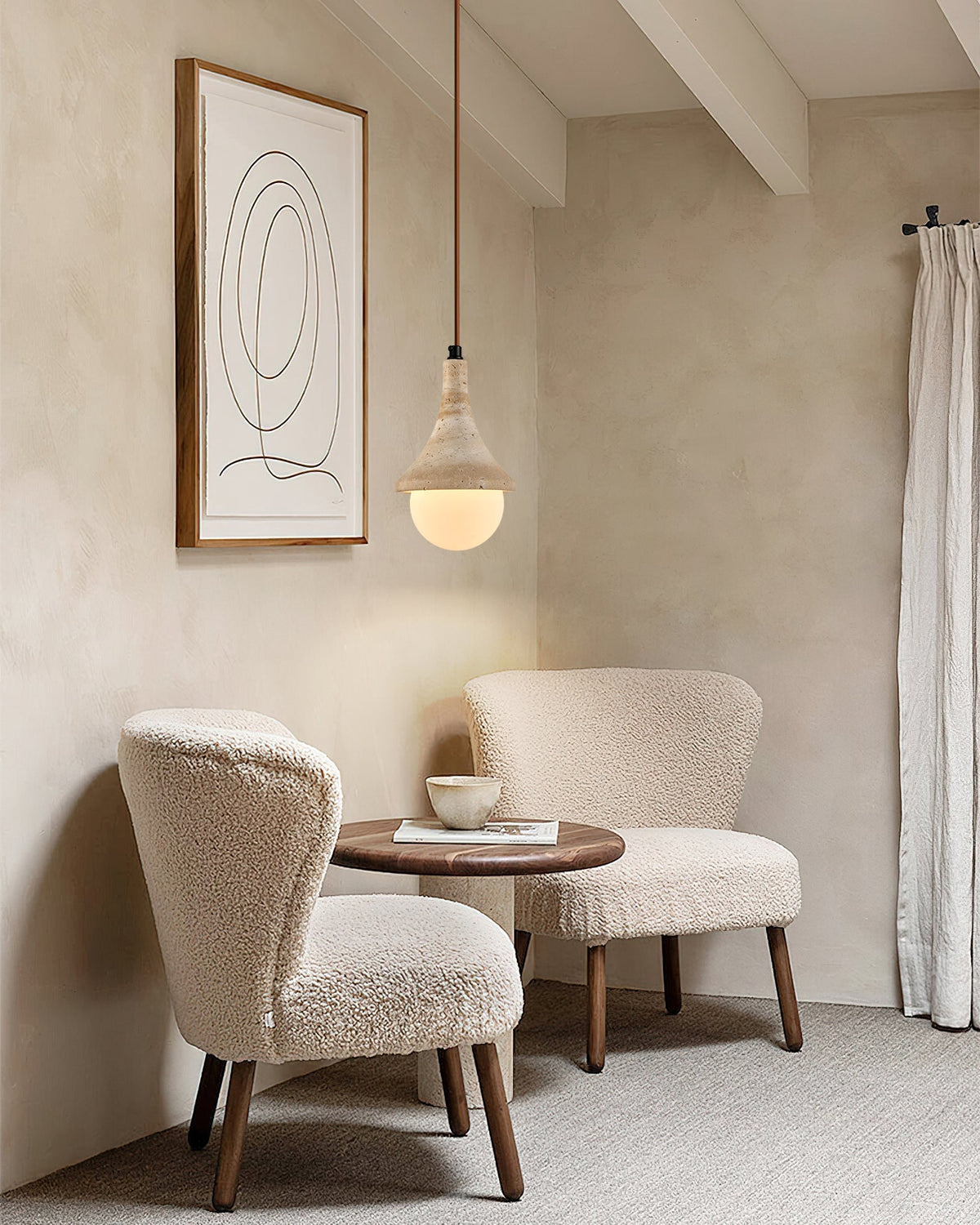 Annadel Pendant Light shown illuminated in a modern living room setting.