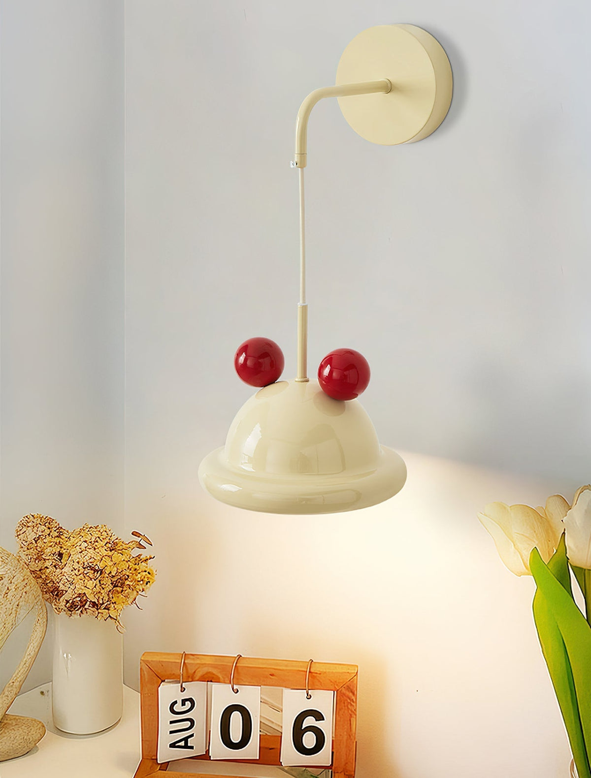 Aries Wall Lamp in the alternative green and red finish.