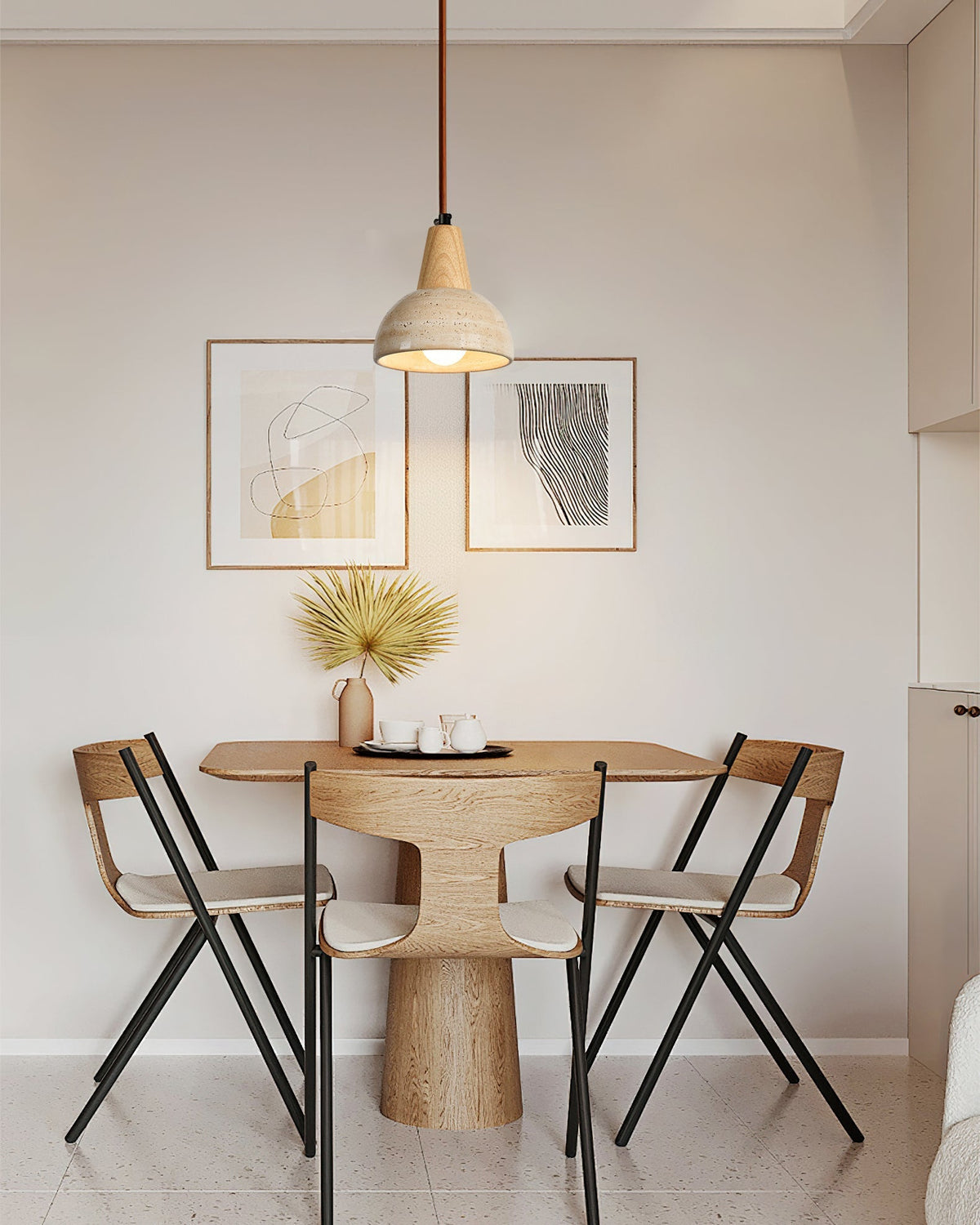 The Arluoe Pendant Lamp hanging over a modern dining table, providing warm illumination.