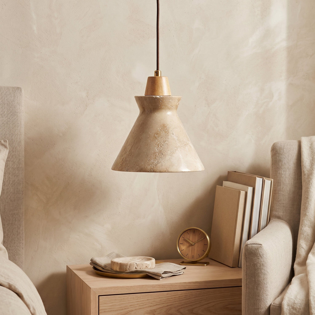 Close-up of the natural travertine stone texture on the Athena pendant.