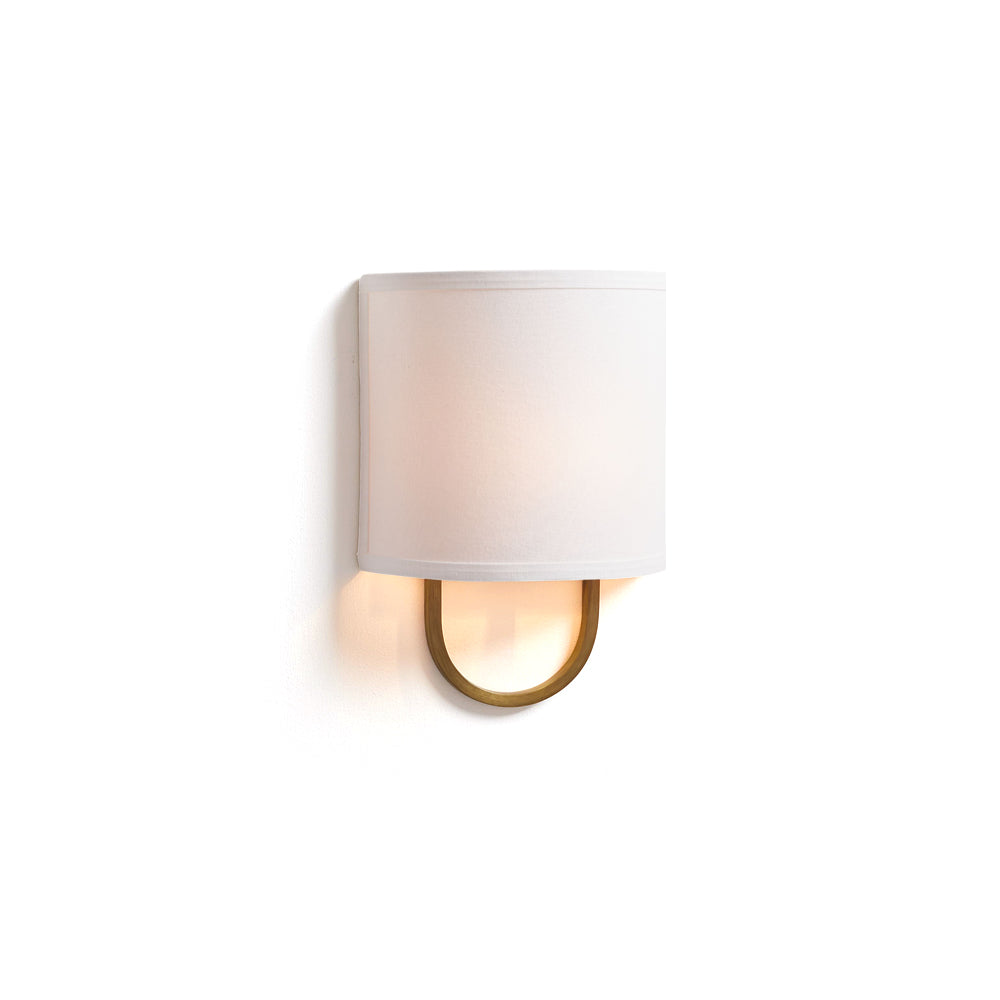 Atticus Wall Lamp with brass finish and white fabric shade.