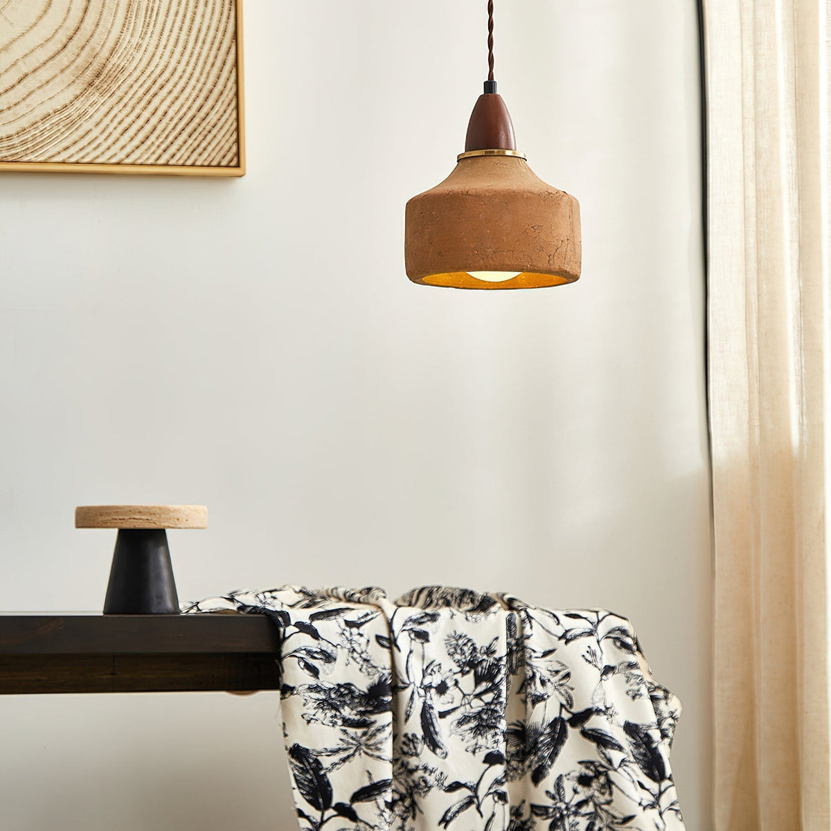 Close-up view of the Auburn Pendant Light's textured terracotta finish.