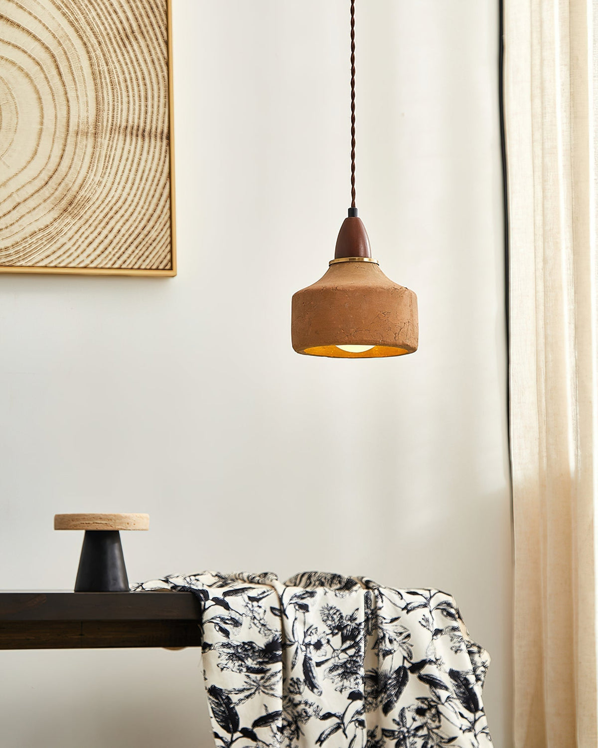Detailed shot of the wood and ceramic components of the pendant light.