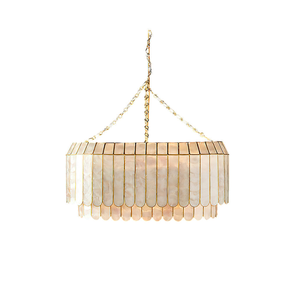 Aurelia Capiz Pendant Lamp with two tiers of shells, shown in a living room setting.