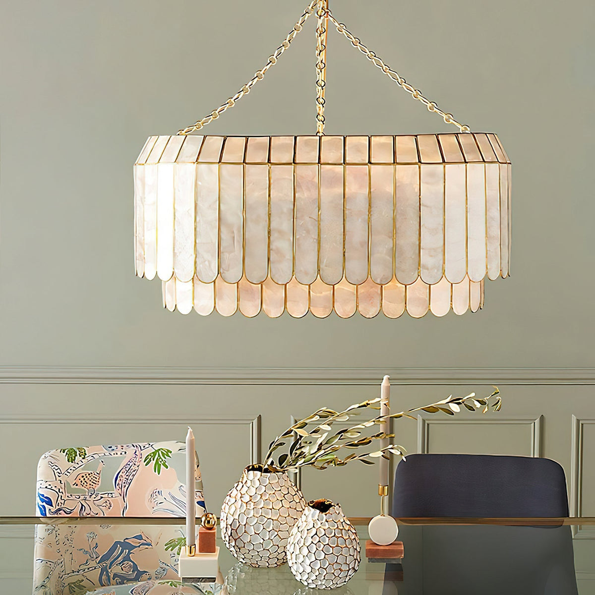 Close-up of the Aurelia pendant lamp's natural Capiz shells and gold metal frame.