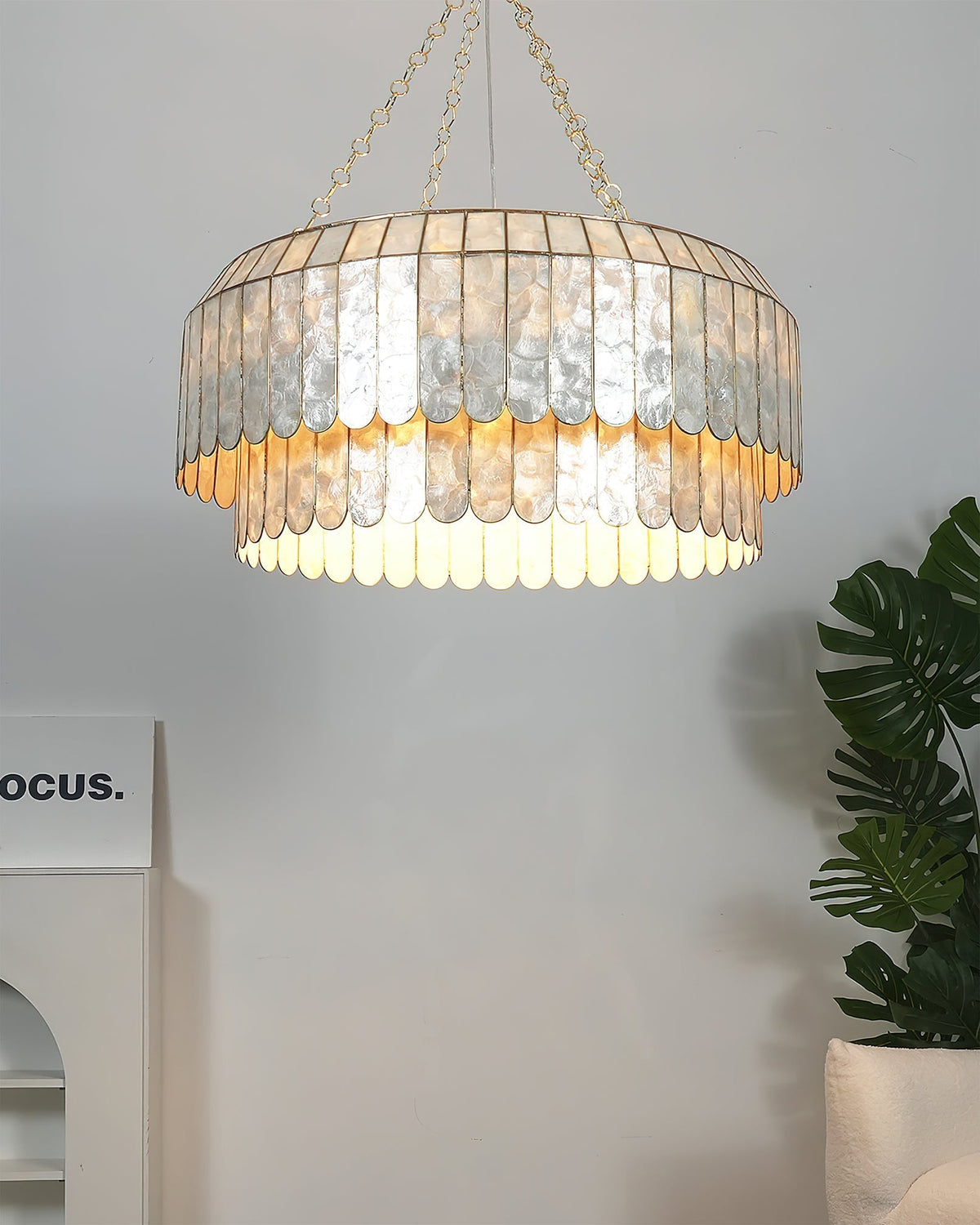 Medium size (23.6 inch) Aurelia Capiz Pendant Lamp on a white background.