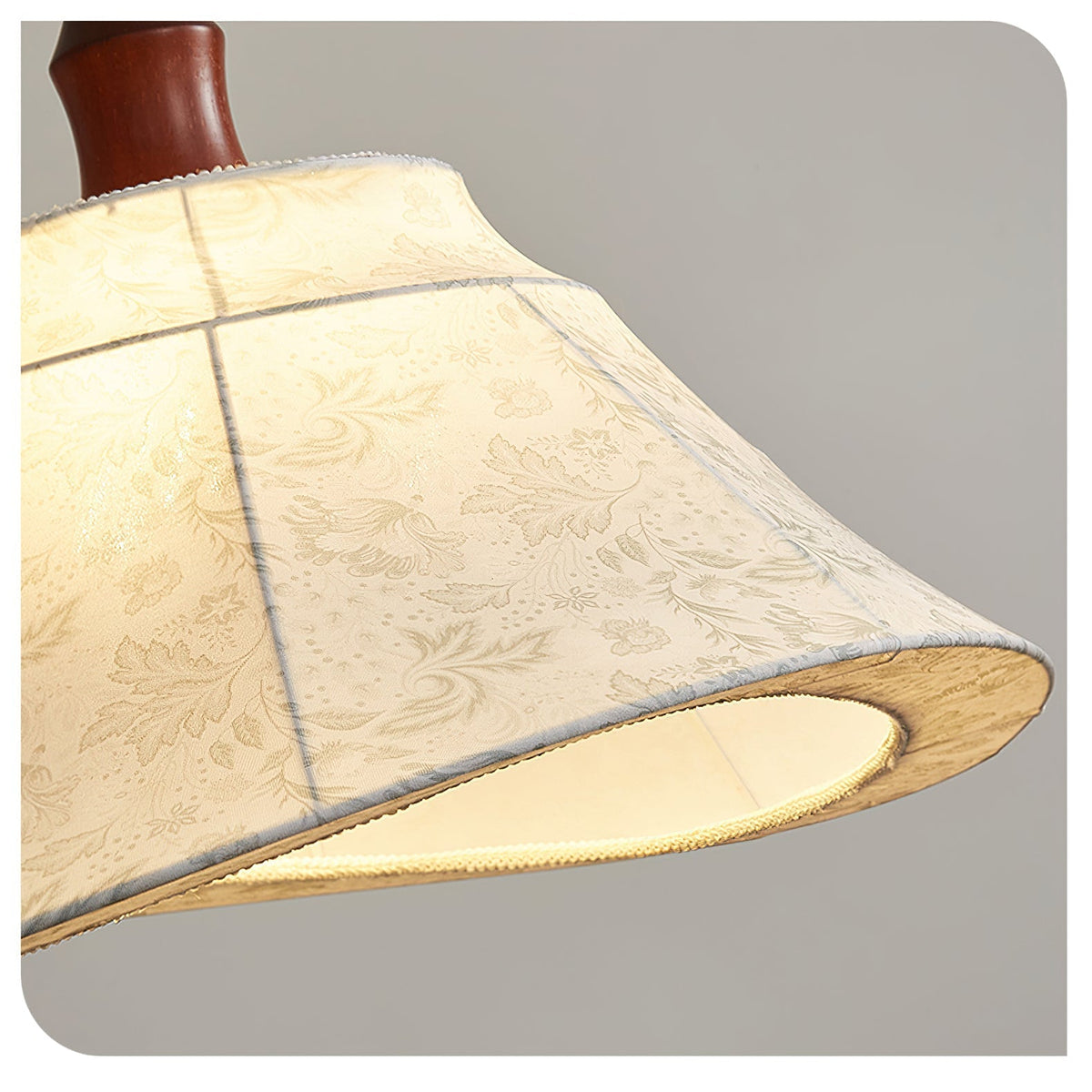 Angled view of the Aurelian Pendant Light showcasing its lantern-like shape.