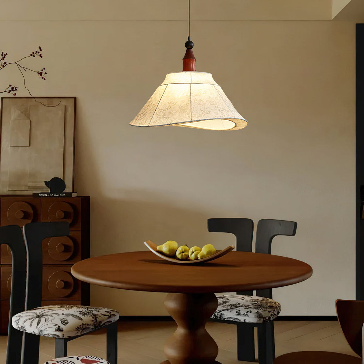 Close-up of the Aurelian Pendant Light's white fabric and wood frame.