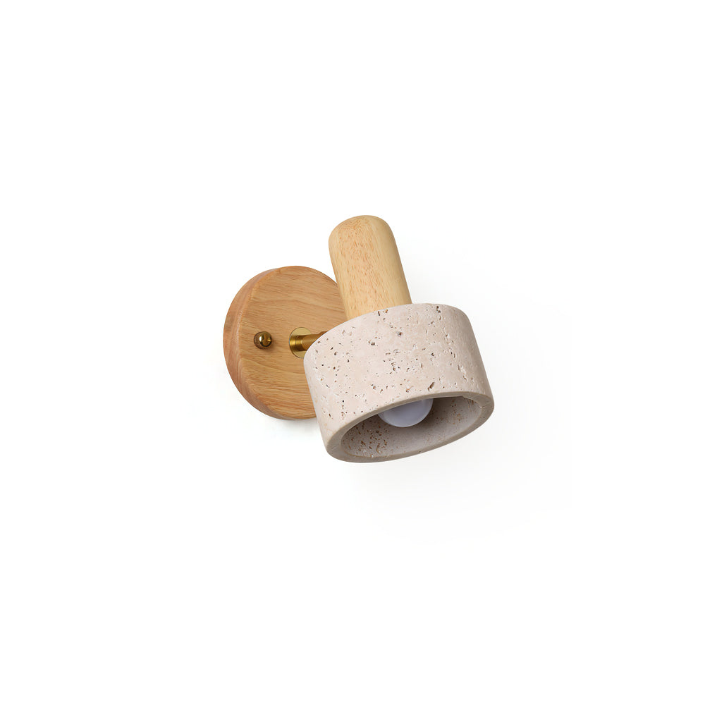 Aureole Wall Light with wood and travertine details against a plain wall.