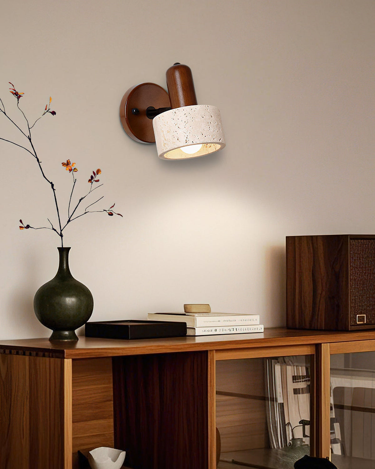 The Aureole Wall Light installed in a modern bedroom above a nightstand.