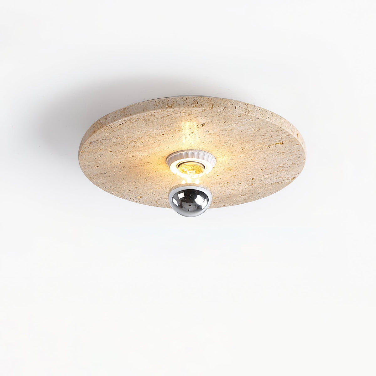 Close-up view of the natural travertine stone texture of the Avize lamp.