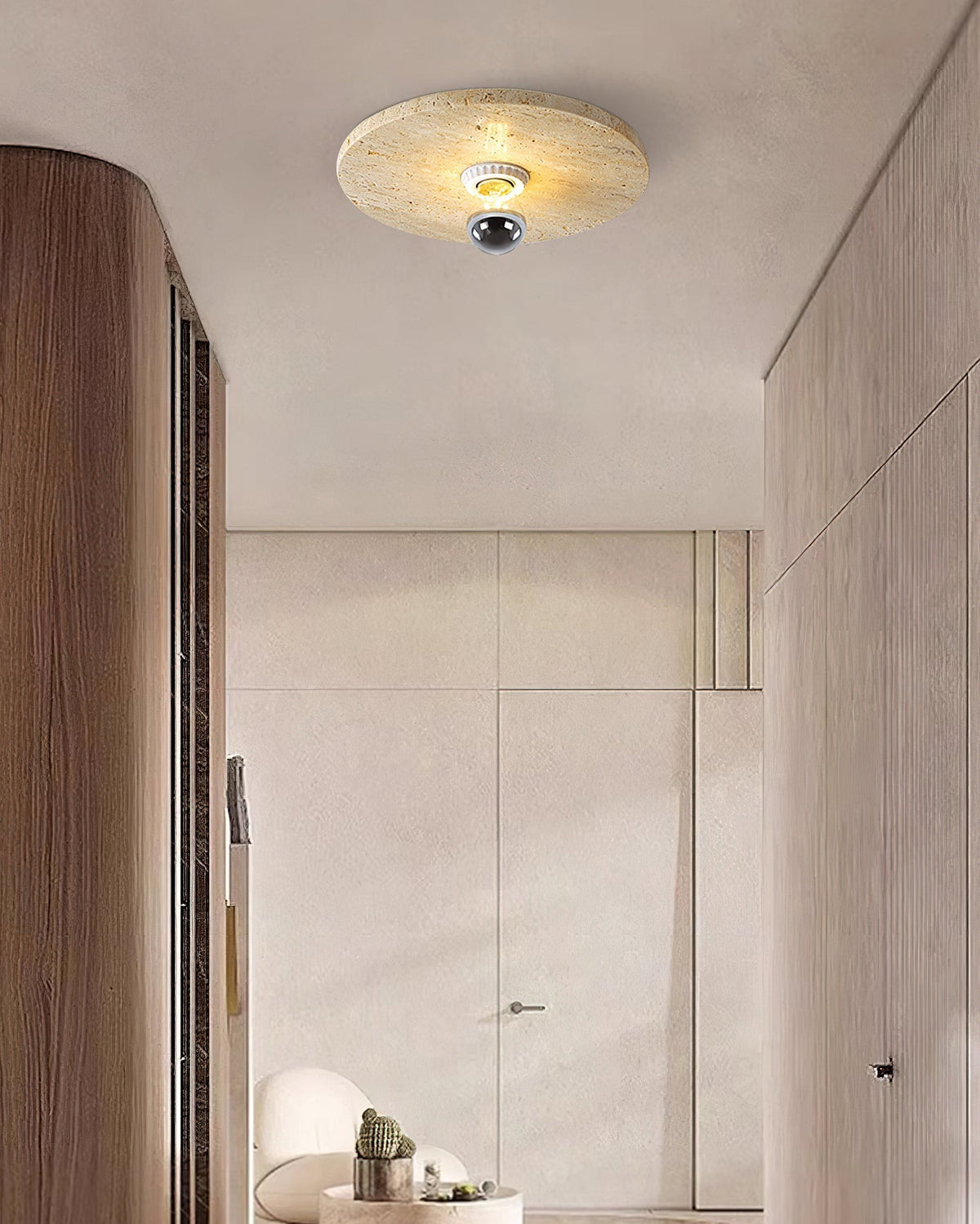 The lamp illuminated, highlighting the translucency of the travertine.
