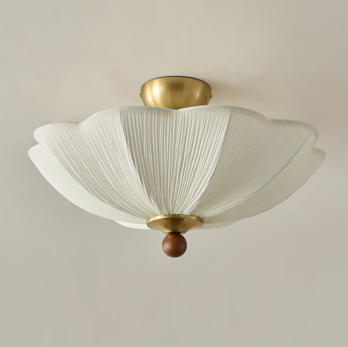 Side profile of the elegant ceiling light against a neutral wall.