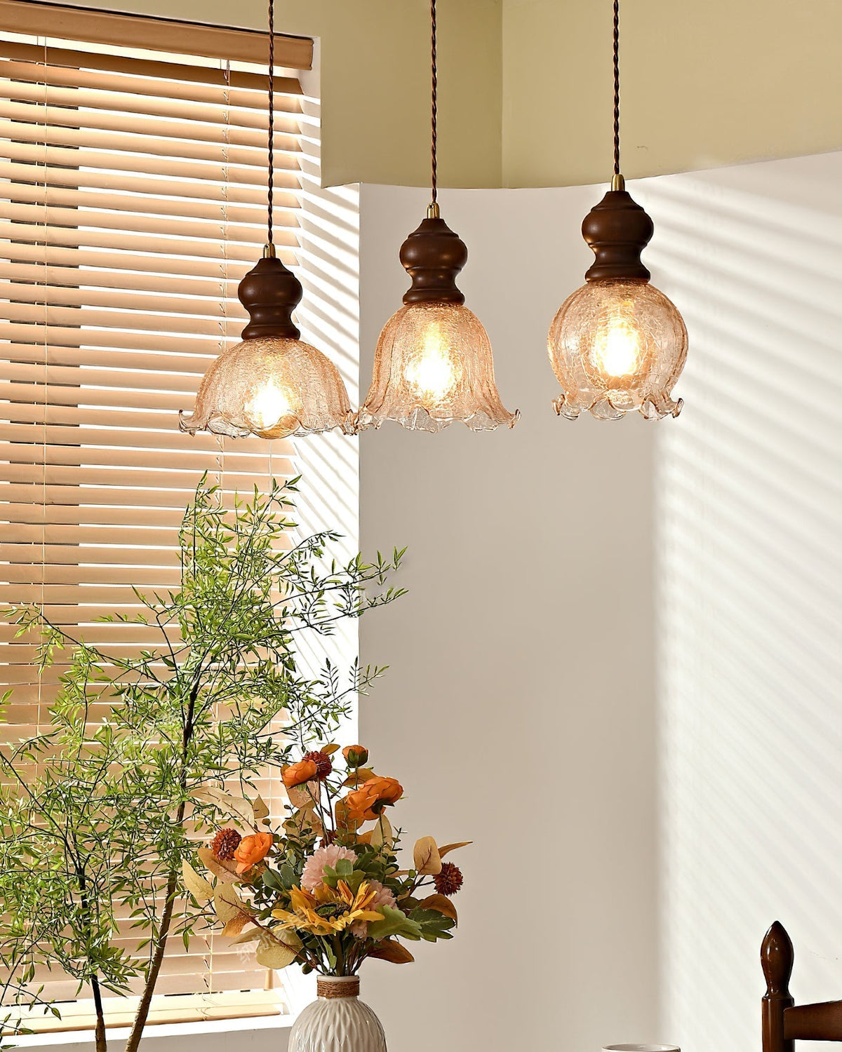 Multiple Barron Pendant Lights hanging at different heights in a dining room.
