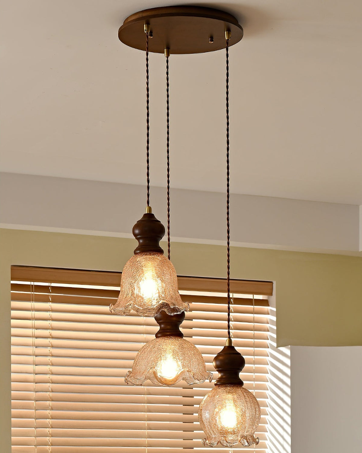 The Barron Pendant Light turned on, casting a warm amber glow.