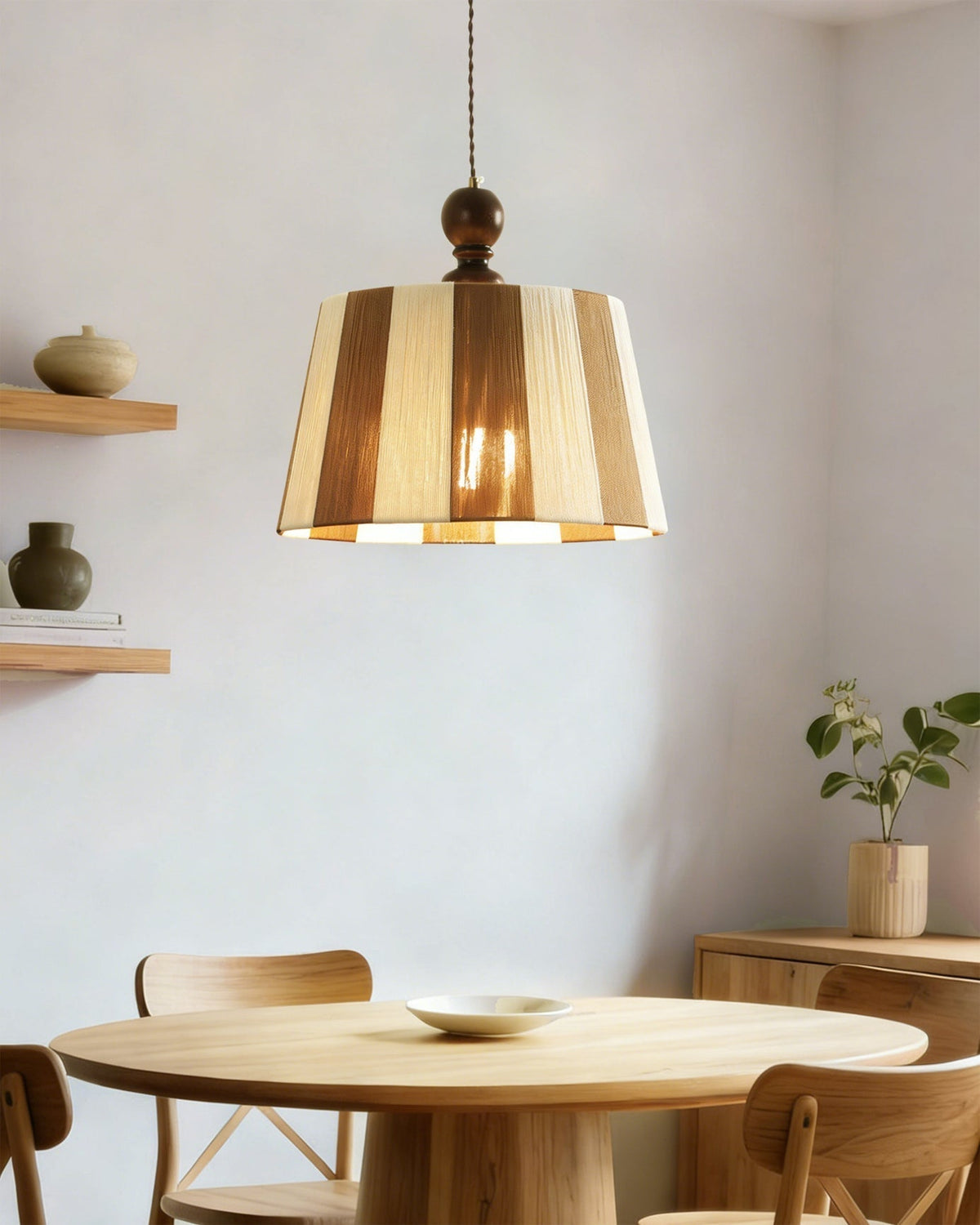 The Beatrice Pendant Light illuminated, casting a warm, soft glow.