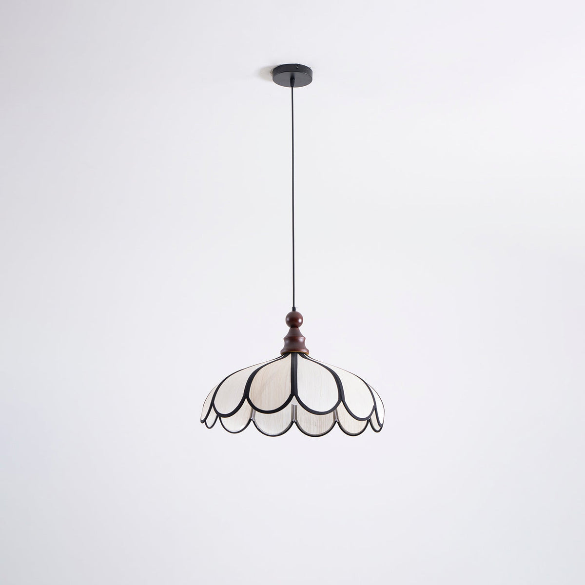 The Botan Pendant Light in a minimalist interior with plants.