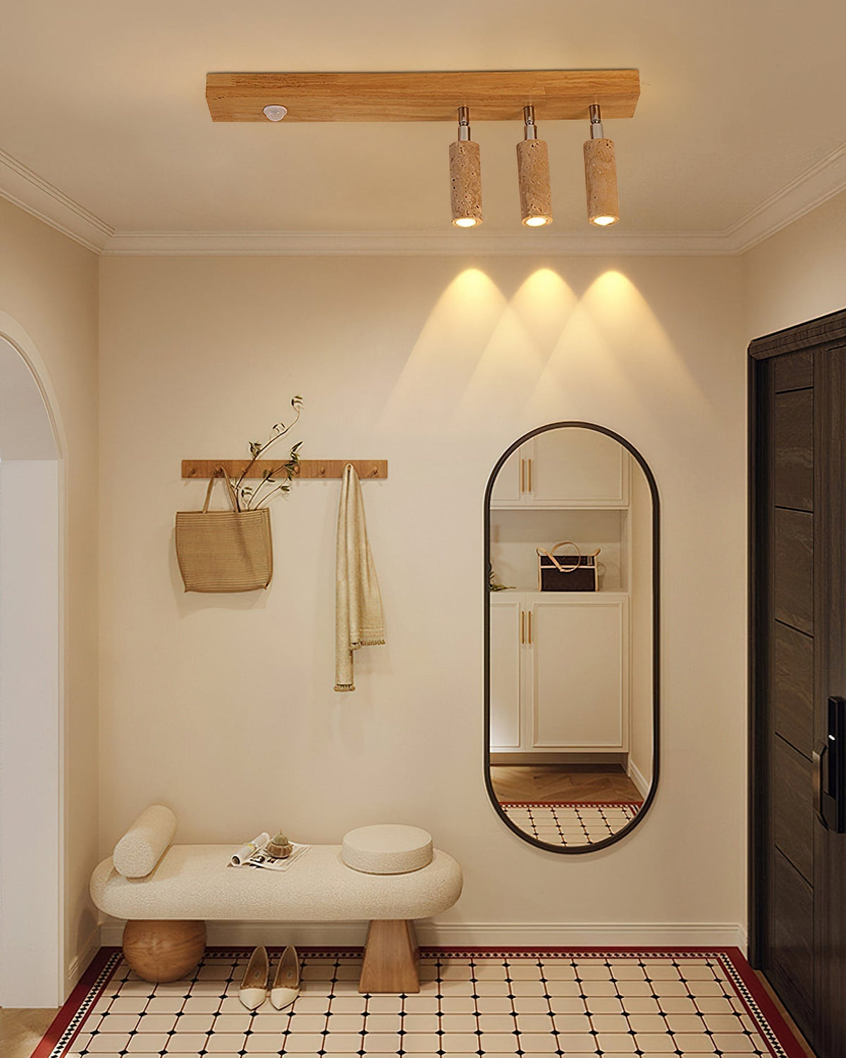 The raw stone texture of the travertine spotlight on the Berge light.