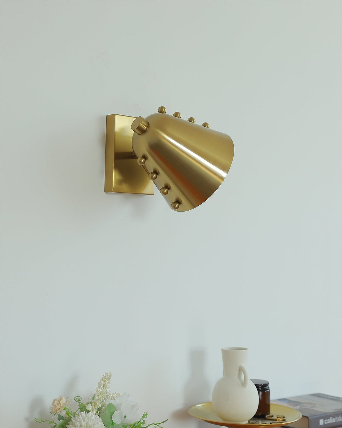 Lifestyle image of the Bespoke wall lamp in a contemporary hallway.