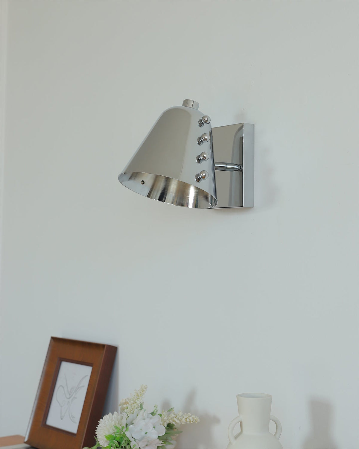Angled view of the Bespoke wall lamp showcasing its geometric design.