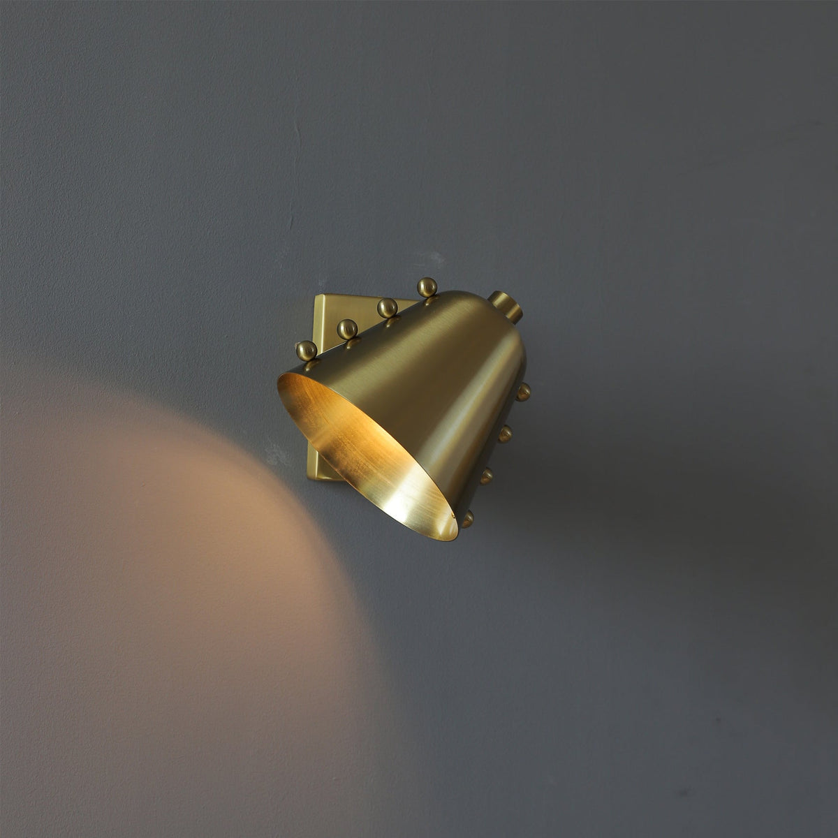 Bespoke wall lamp detail showing the wall mount.