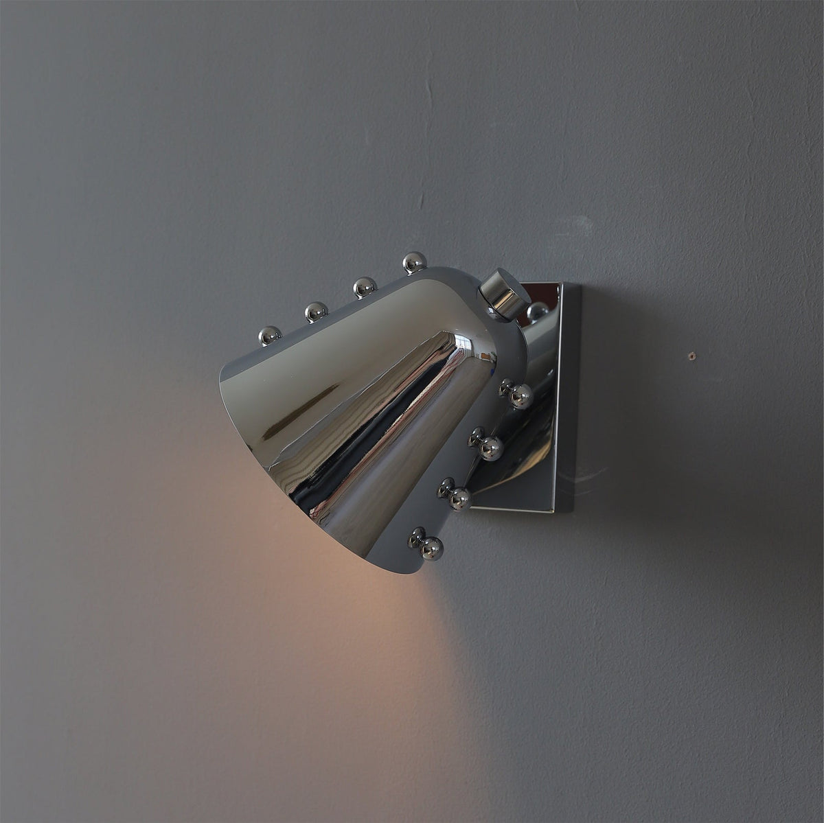Bespoke wall lamp in a black finish, unlit.
