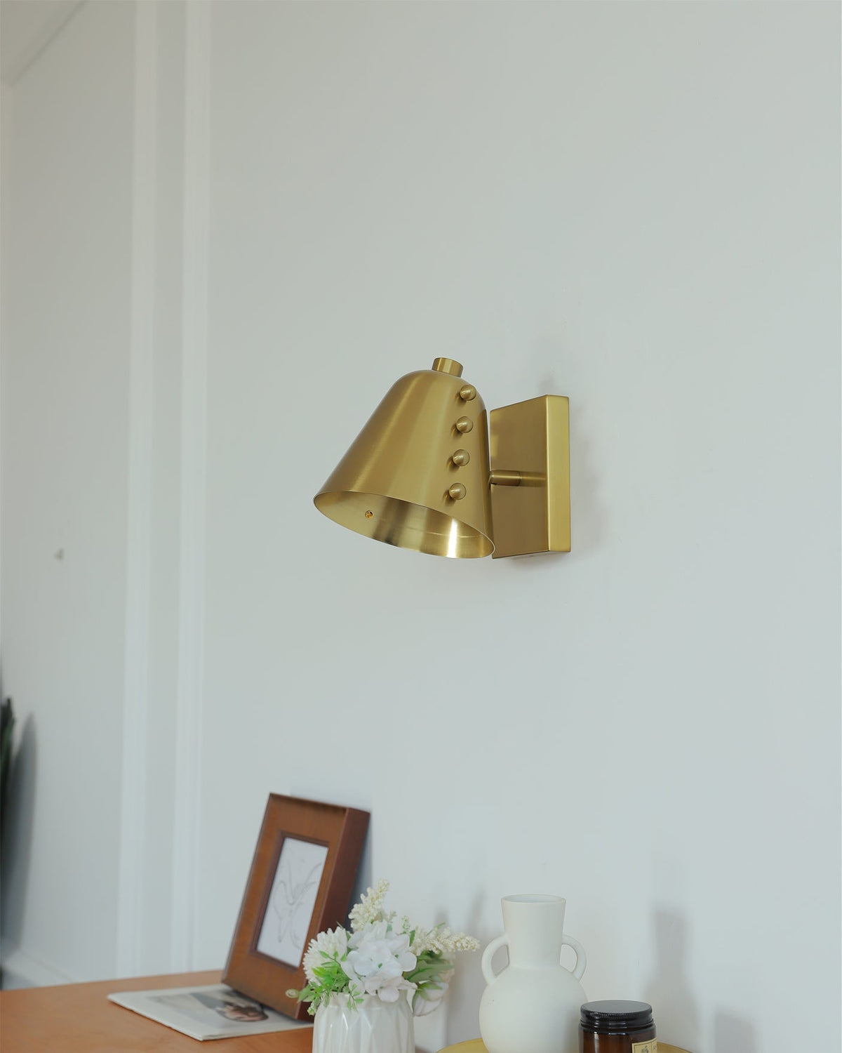 Bespoke wall lamp in a hallway, creating an inviting atmosphere.