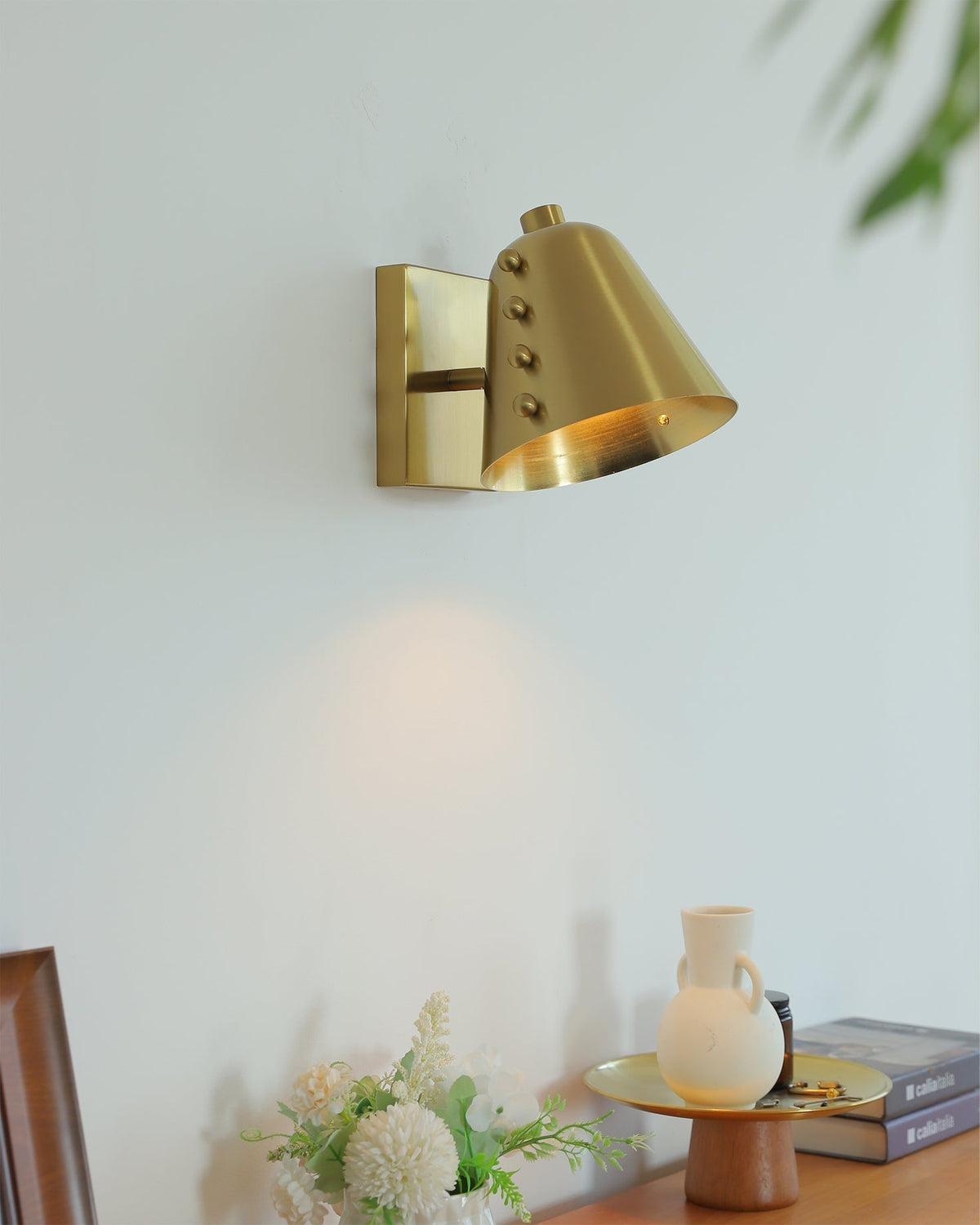 Bespoke wall lamp shown in gold finish.