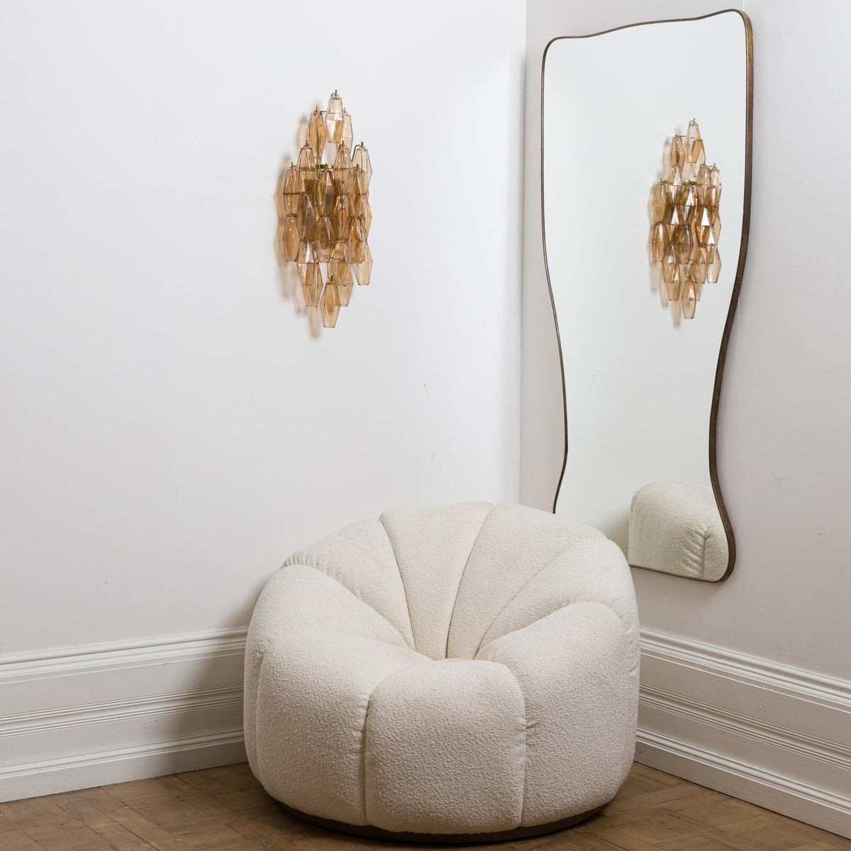 The Biscayne sconce installed in a tall entryway, providing ambient light.