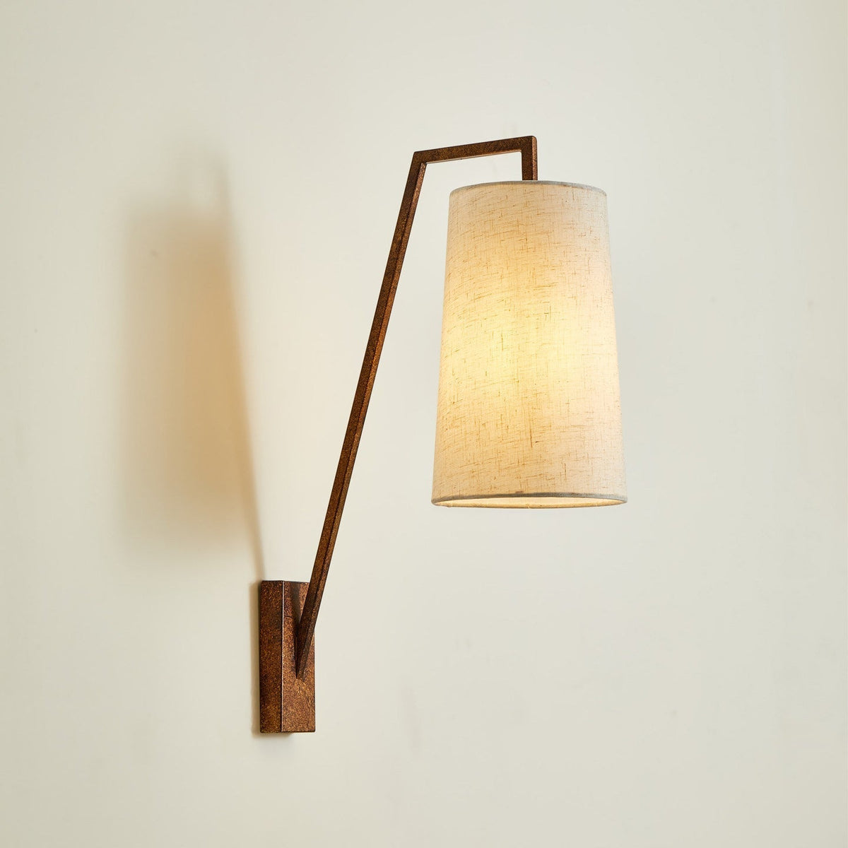 Comparison of the black, brass, and antique bronze finishes of the Bonny Wall Light.