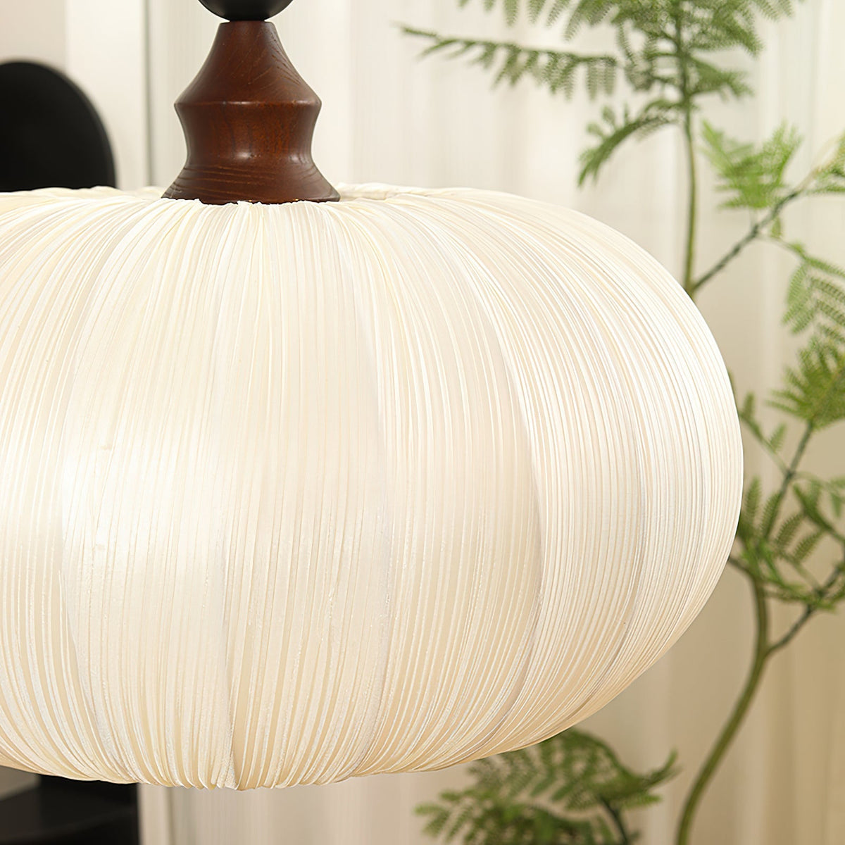 The Bowie Pendant Light in a black and wood finish.