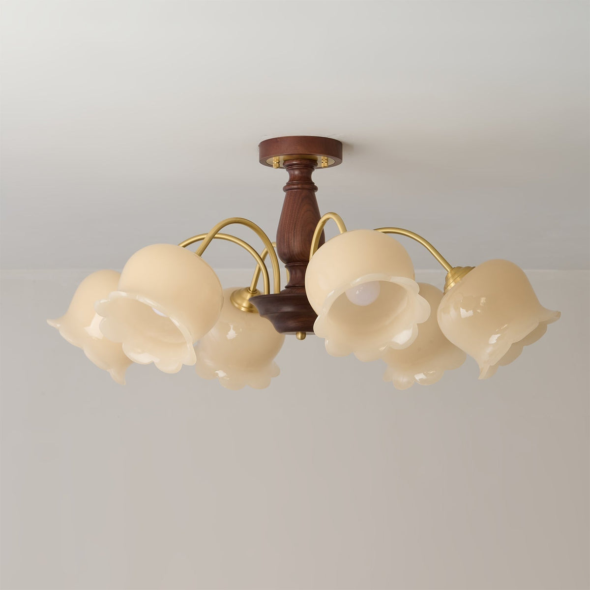 The Cacier Chandelier installed in a bedroom, providing warm ambient light.