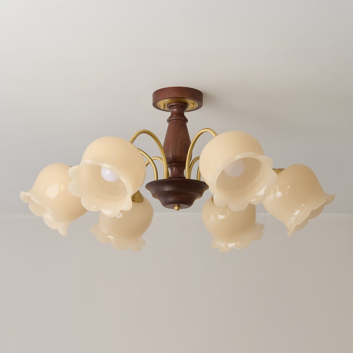 The Cacier Chandelier hanging over a modern dining table.