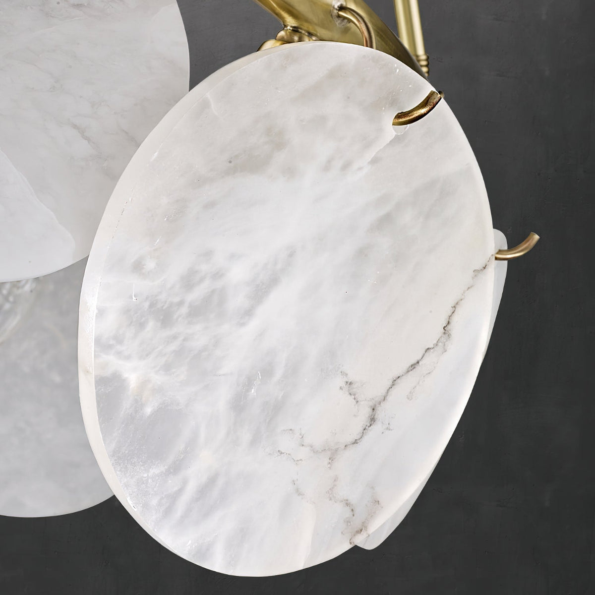 The chandelier shown unlit to display its sculptural beauty.