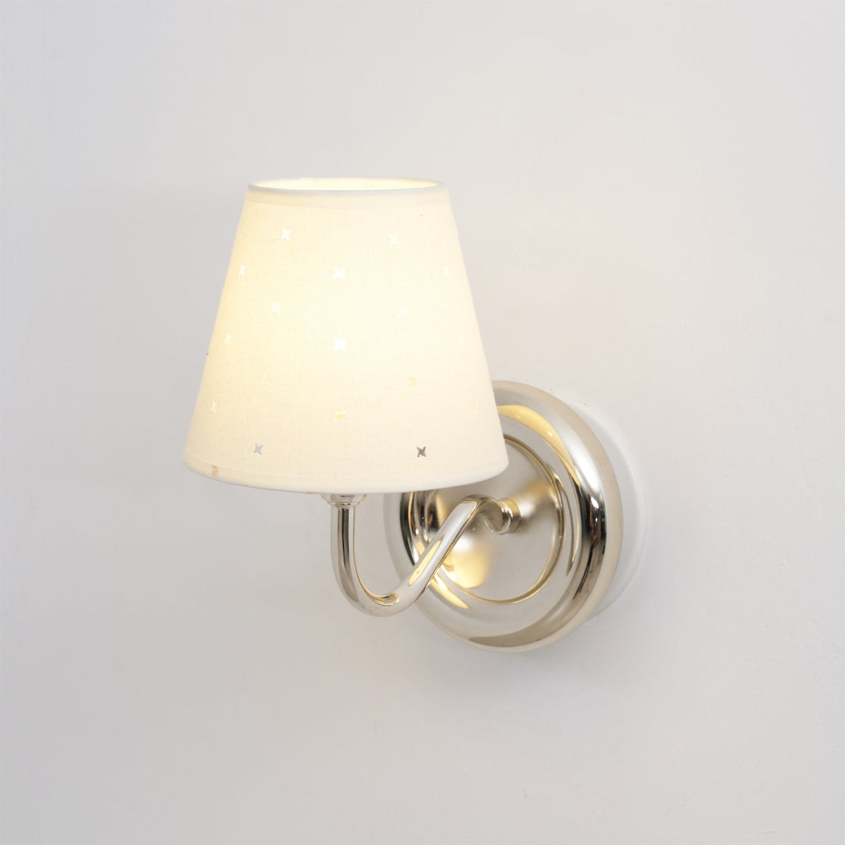 Front view of the white and chrome Caleb Starburst Wall Sconce.
