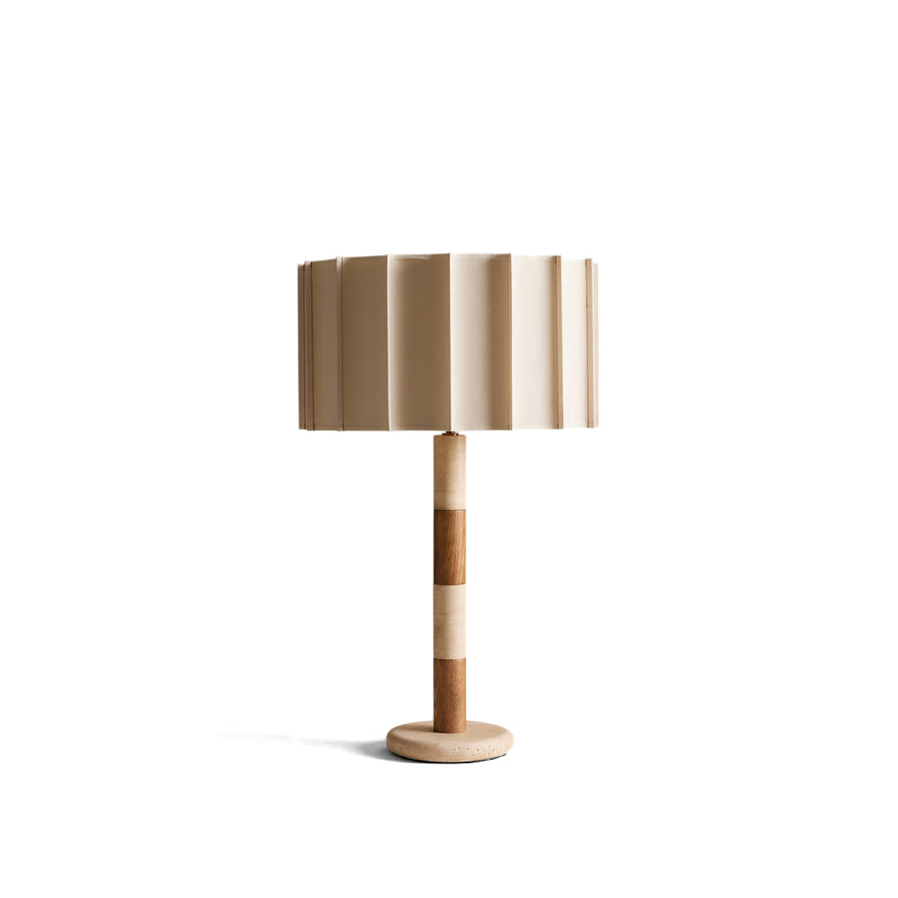 Calypso Table Lamp with travertine base and pleated shade on a neutral background.