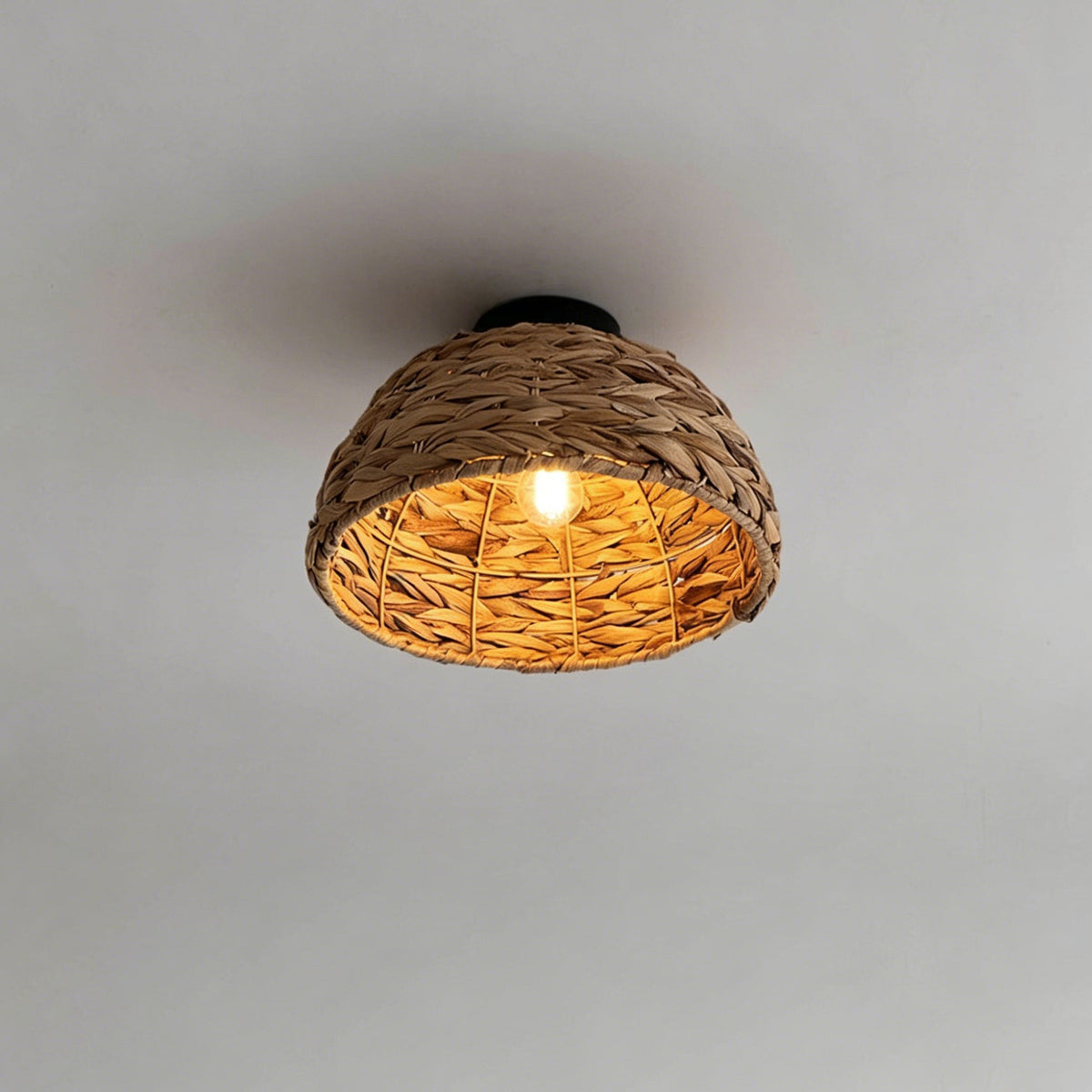 Lifestyle image showing the Cambria Ceiling Light in a bright, airy bedroom setting.