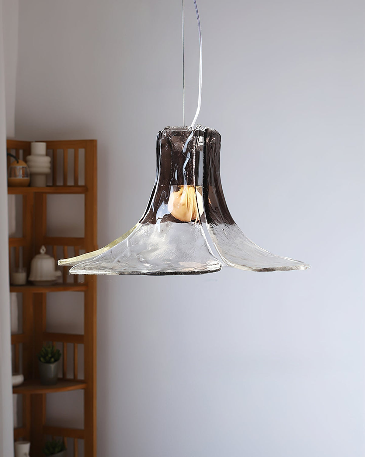 The Carlo Pendant Light hanging above a modern dining table.