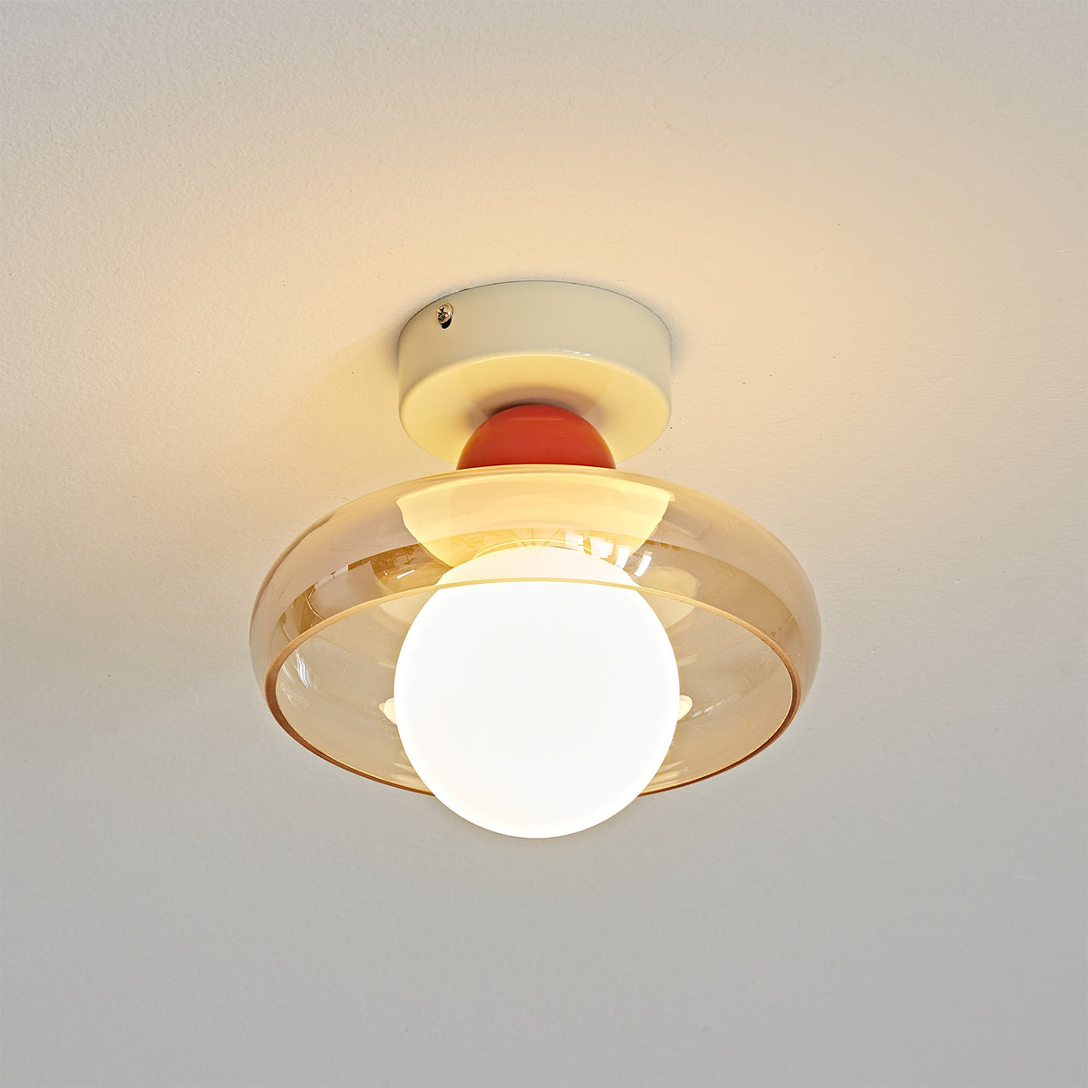 Lifestyle image showing the Alabax Ceiling Light in a minimalist dining area.