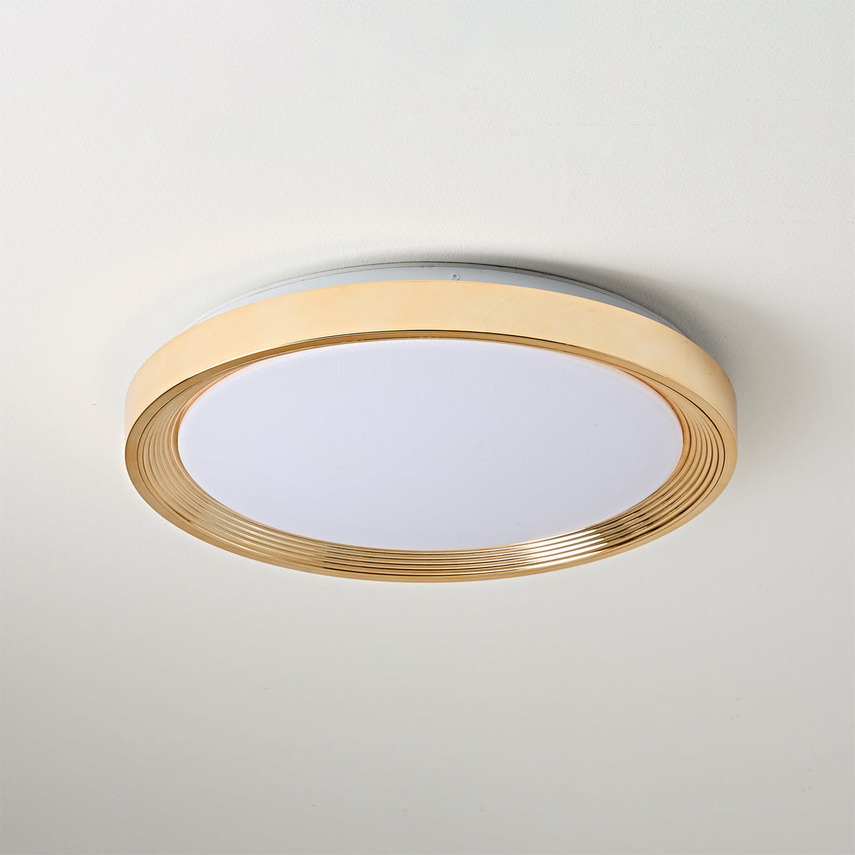 Cerova Ceiling Light in gold finish, turned on.