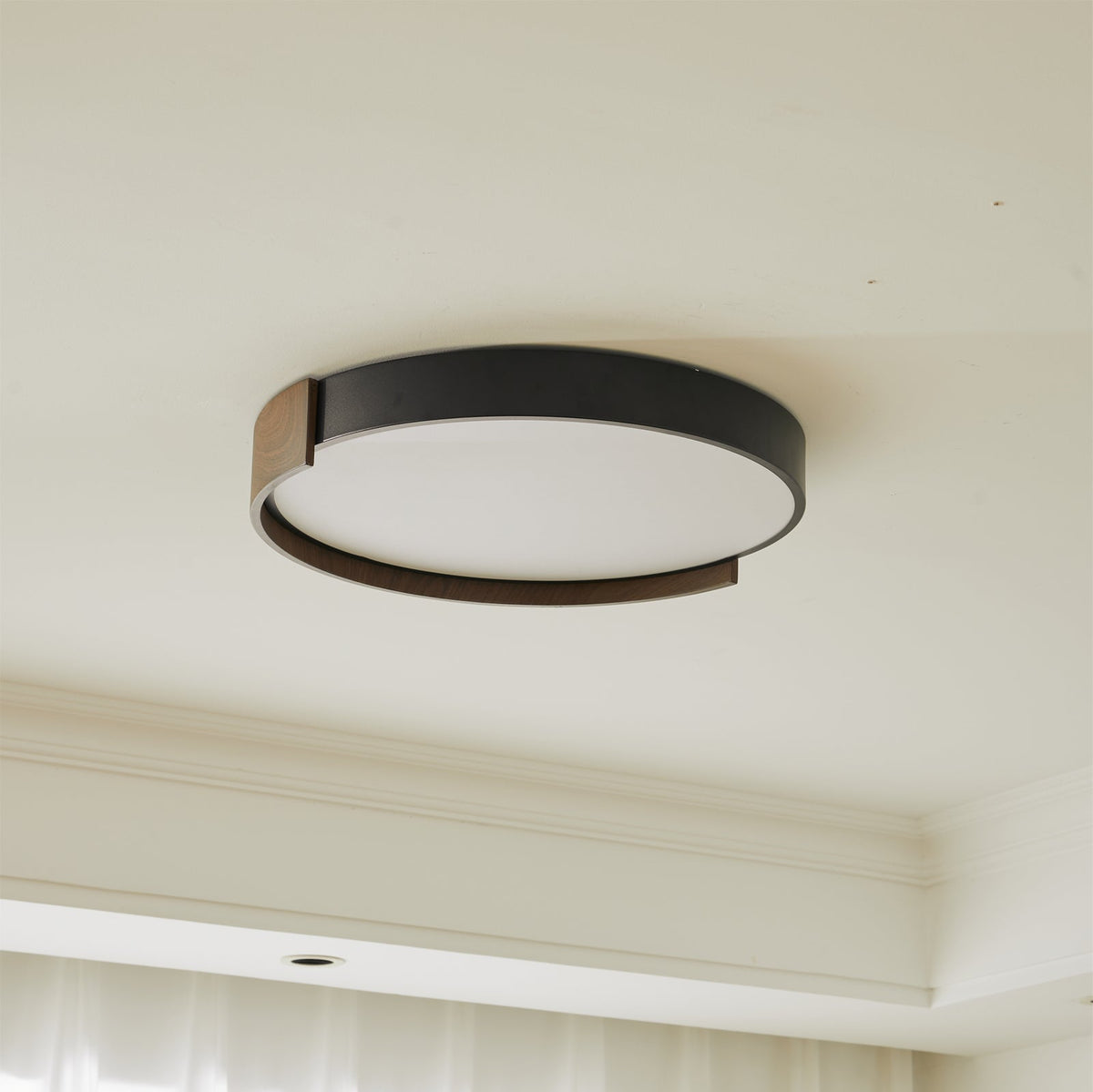 Lifestyle image of the ceiling light over a dining table.